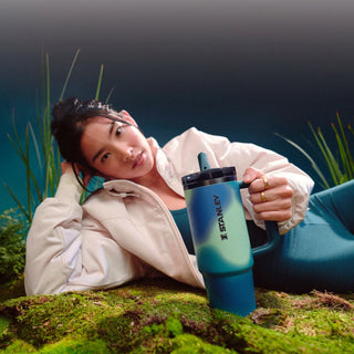 Front shot camera of a model holding the New Frenquency Quencher ProTour
